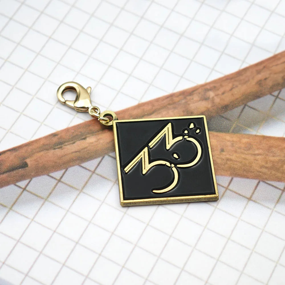 Expedition 33 Double-Sided Metal Keychain