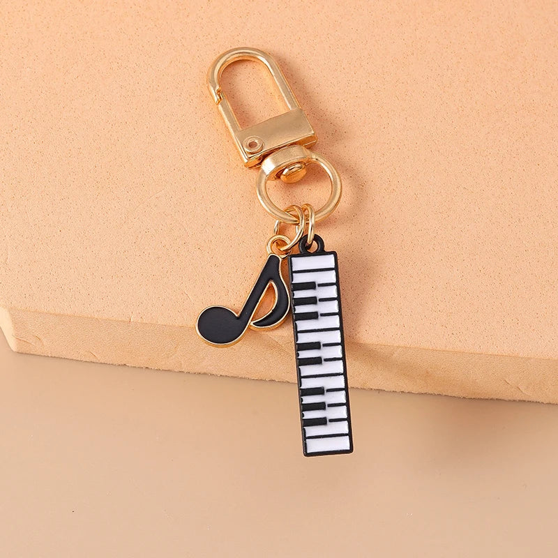 Piano and Music Note Keychain in Gold Tone